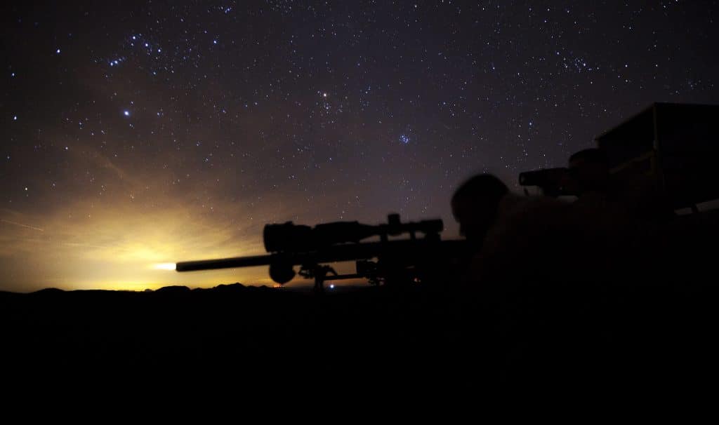 Mounted thermal riflescope at night.
