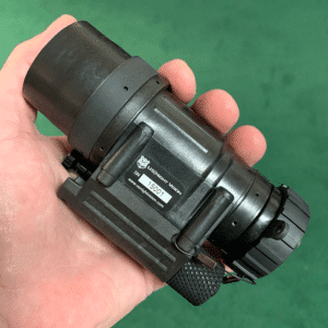 Photo of a AN/PVS-14A GEN III unit in the palm of a hand.